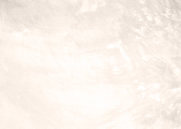 istock Pink white cement texture plastered stucco wall painted fade background. 1043493296