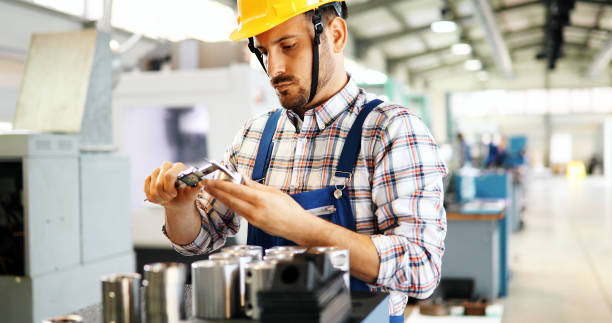 istock modern industrial machine operator working in factory 1043493434