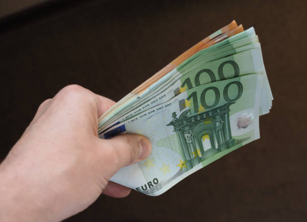 istock Hand with Euro notes, European Union 1043497692