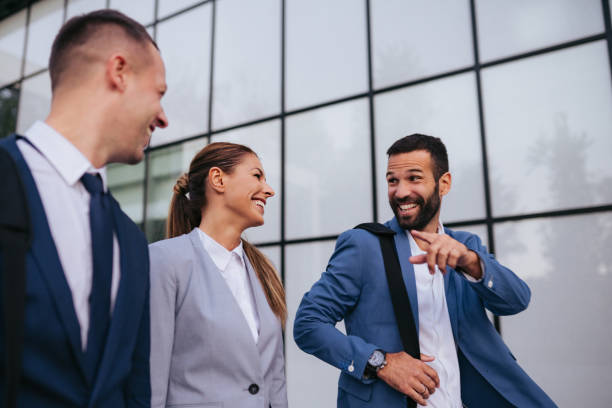 istock Three business colleagues having discussion while walking outdoors 1043506854