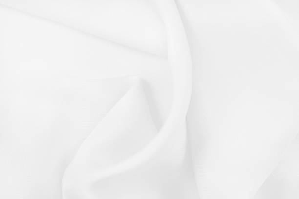 istock White fabric texture for background and design, beautiful pattern of silk or linen. 1043510432