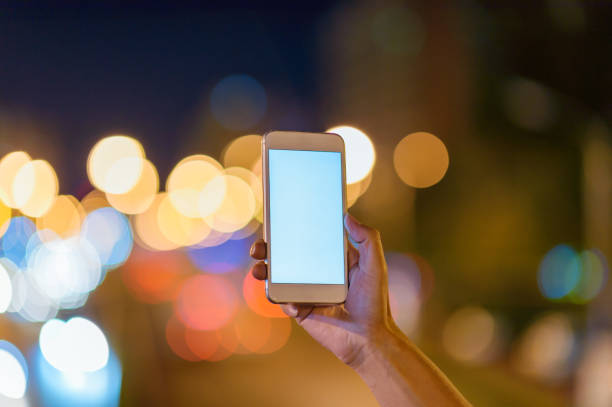 istock Blank smart phones at night 1043515340