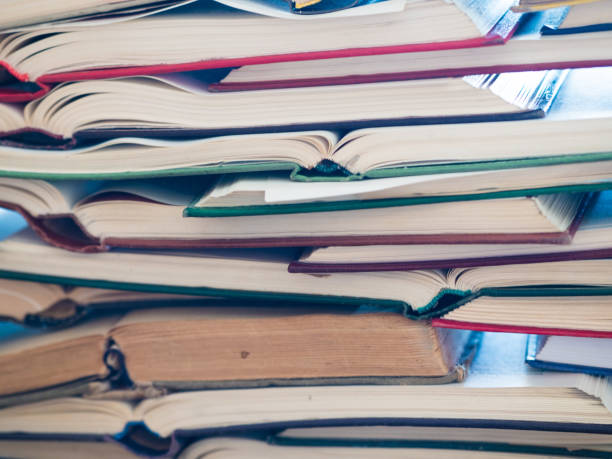 istock Stack of open books. Library, literature, education, information, learning, reading concept 1043518182