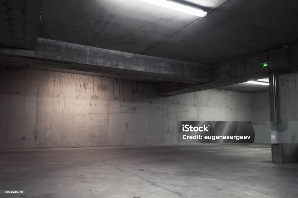 Abstract empty garage interior, background Abstract empty garage interior, background with concrete walls and white ceiling lights Backgrounds Stock Photo