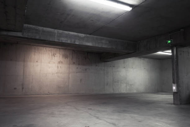 Abstract empty garage interior, background Abstract empty garage interior, background with concrete walls and white ceiling lights parking lot photos stock pictures, royalty-free photos & images