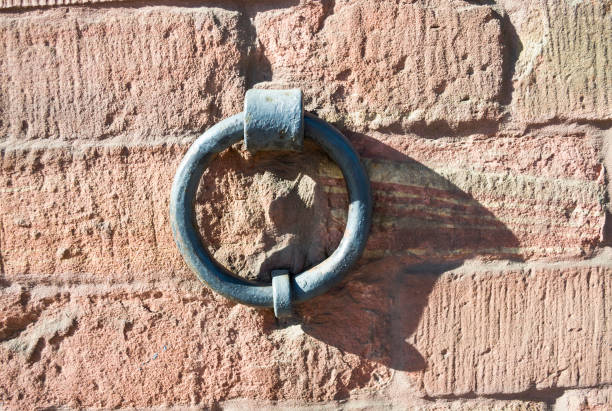istock Brick texture with a vintage metal ring. 1043523836