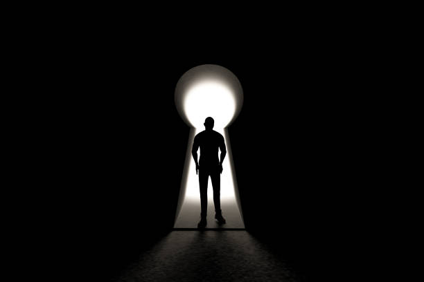 istock man silhouette standing front of a door 1043524180
