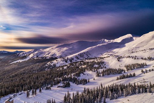 Winter higth in Carpatian mountains, beautiful dawn landscape with a bird's eye view, drone camera.