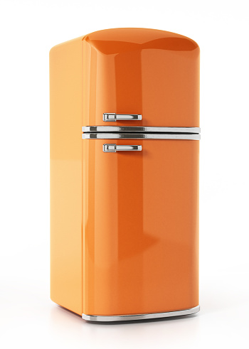 Vintage orange refrigerator isolated on white.
