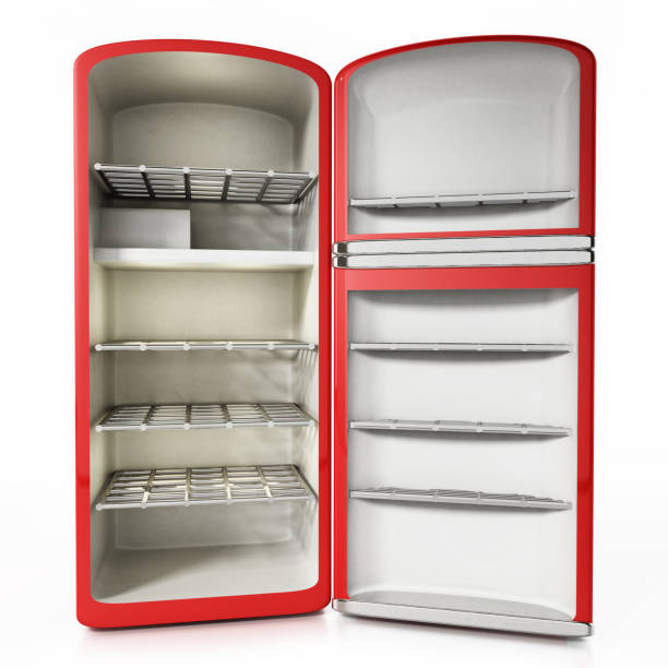 Vintage empty refrigerator with open door isolated on white.