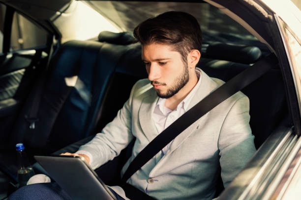 istock Young businessman in a car 1043529348