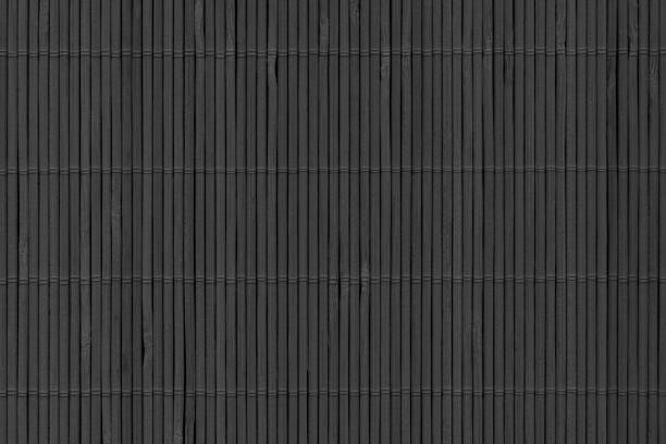 istock Black Stained Slatted Interlaced Bamboo Place Mat Rustic Texture 1043529486