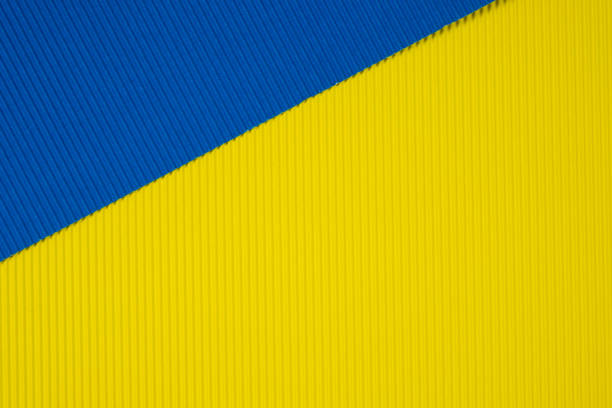 istock Blue and yellow corrugated paper texture, use for background. vivid colour with empty space for add text or object. 1043529668
