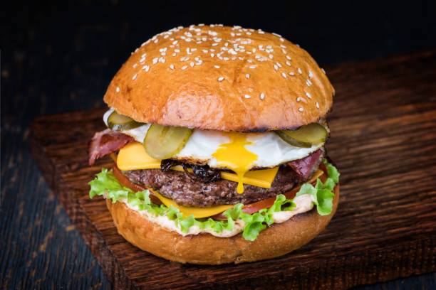 istock Burger on a wooden board 1043532700