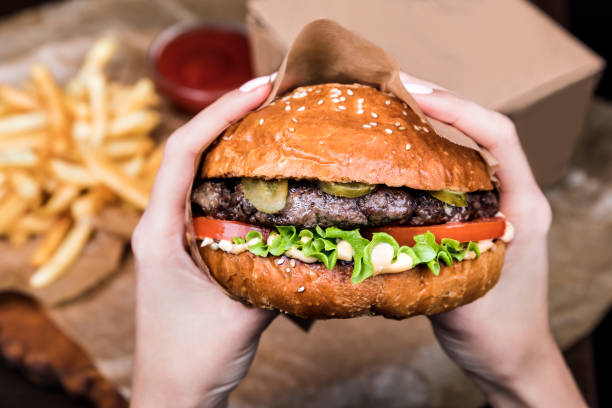 istock Burger on a wooden board 1043533032