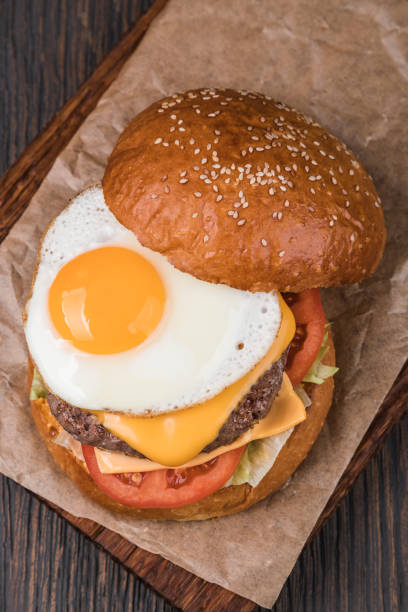 istock Burger on a wooden board 1043533042