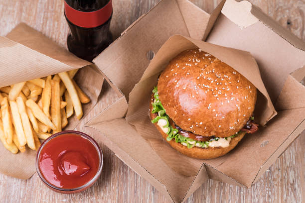 istock Burger on a wooden board 1043533378