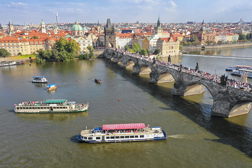 Huge Aerial Panorama of Prague with the Charles Bridge crowded with Tourists on this beautiful late summer day. Converted from RAW.