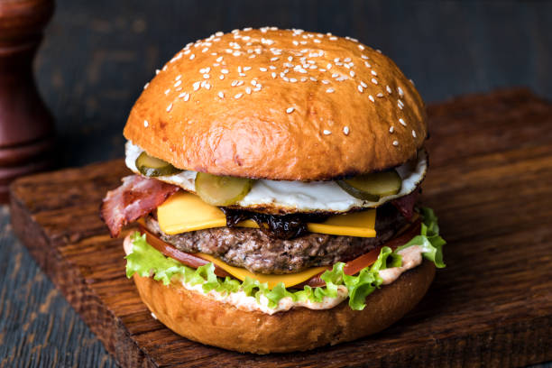 istock Burger on a wooden board 1043534544
