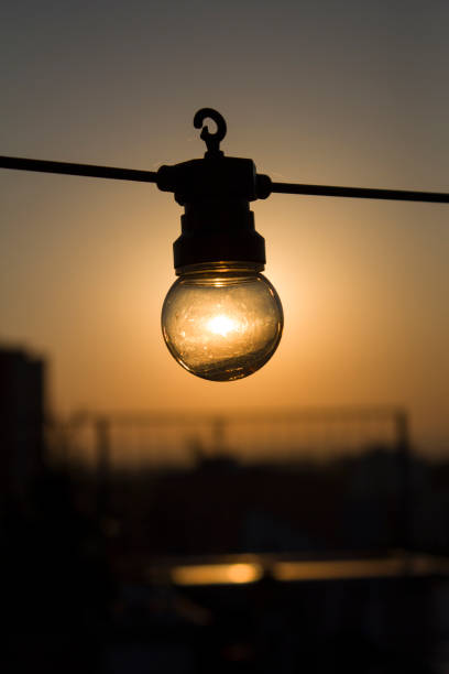 Outdoor string lights hanging in line.