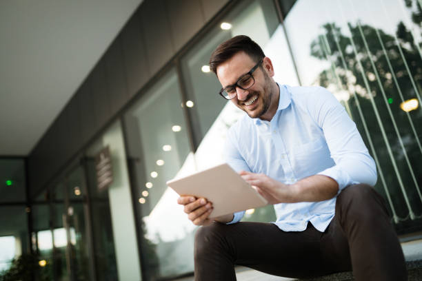 istock Businessman having tablet and phone at hand 1043535834