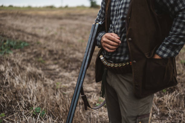istock Close-up of a hunter loading his shotgun 1043539968