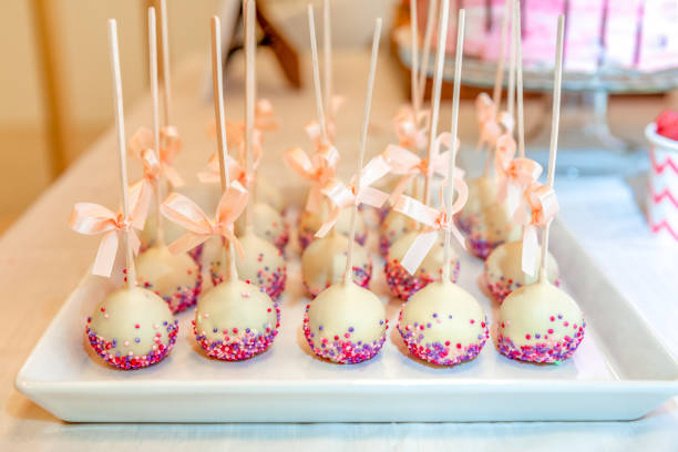 istock Cake pops decorated with bows on a plate 1043540032