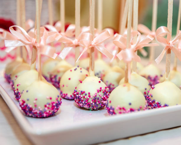 istock Cake pops decorated with bows on a plate 1043540104