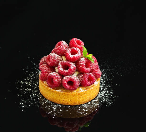istock sand tartlet with raspberries. 1043540242