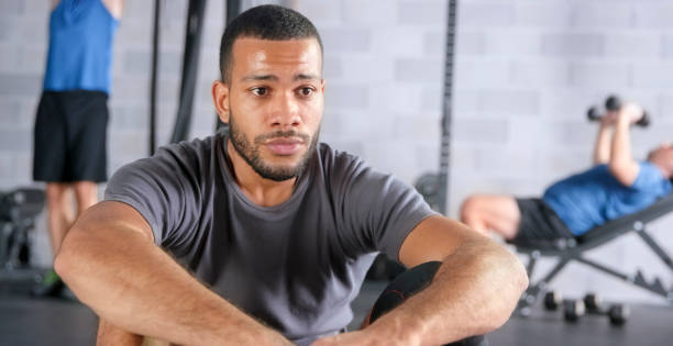 istock Man sitting in gym 1043542874