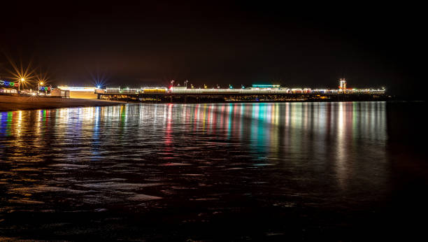istock Paignton seafront and pier at night 1043546610