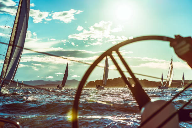 Sailing regatta on sunny autumn morning Boat deck POV from a sailboat during a regatta. event Property released. Taken by Sony a7R II, 42 Mpix. sailboat sports race yachting yacht stock pictures, royalty-free photos & images