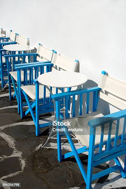 Cafe Tables And Chairs Stock Photo - Download Image Now - Aegean Islands, Blue, Cafe