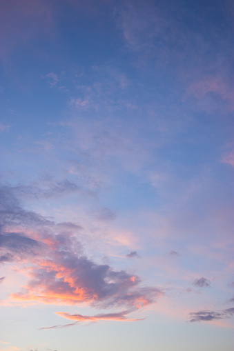 Immerse yourself in the ethereal beauty of a pastel sky adorned with shades of pink, red, and abstract cloud formations, creating a captivating backdrop for nature scenes and real estate photography. The soft sunlight gently illuminates the sky, casting a warm and inviting glow that adds a touch of serenity and charm to any setting.