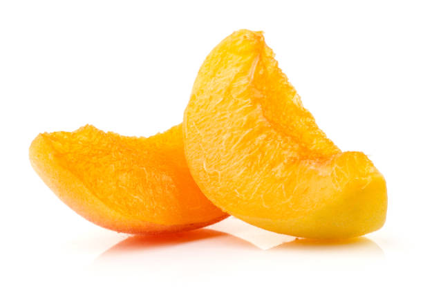 Slices of apricot isolated on white background