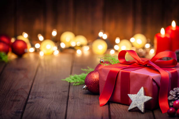 istock Red Christmas gift box on rustic wooden table 1043554676