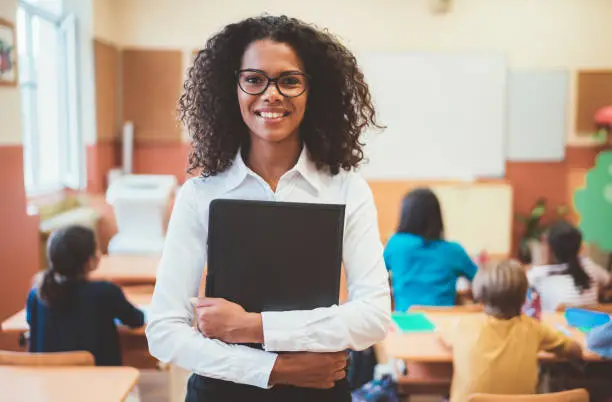 Photo of Mixed race teacher in the classroom