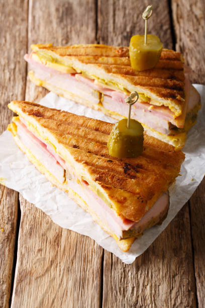 istock Delicious hot Cuban sandwich close-up on the table. vertical 1043554882