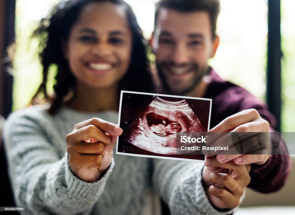 Happy couple with pregnancy news Pregnant Stock Photo