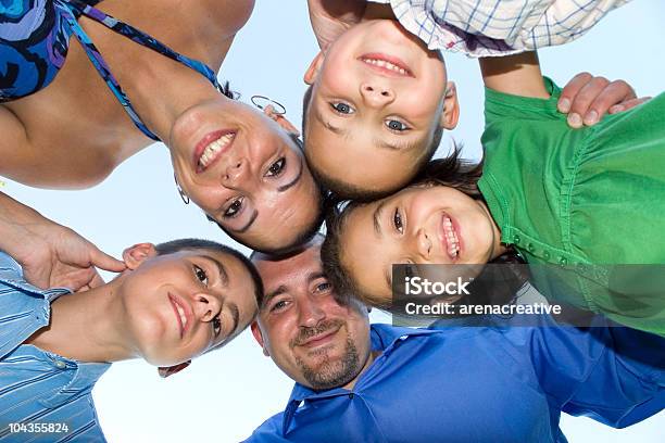 Happy Family Huddle Stock Photo - Download Image Now - Cheerful, Child, Color Image