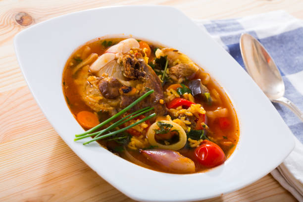 istock Lamb's soup cooked with rice, vegetables, onion and garlic 1043569352