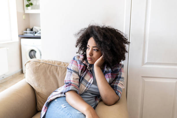 istock Sad african woman at home 1043573770