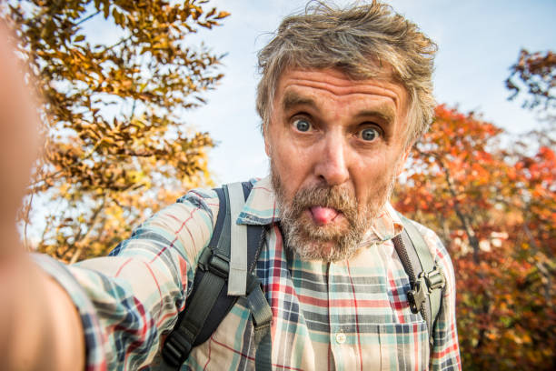 Senior Hiker Man Outdoors in the Mountains.