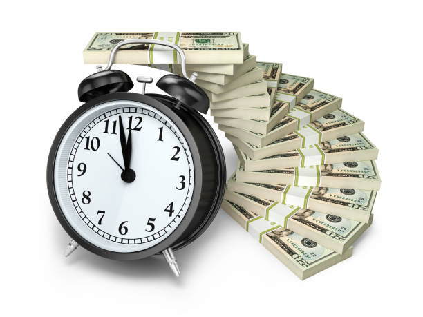 istock $20 Banknote and Alarm clock 1043577654