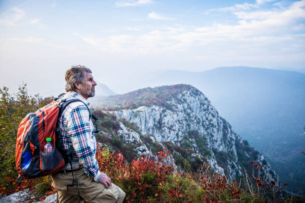istock Senior Hiker Man Outdoors in the Mountains 1043581792