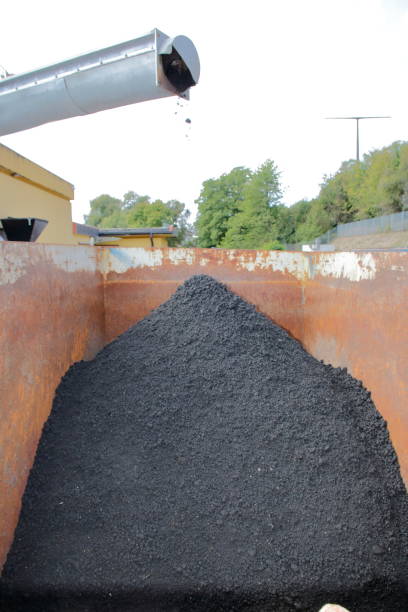 istock Filling a container in a sewage treatment plant with sewage sludge 1043582074