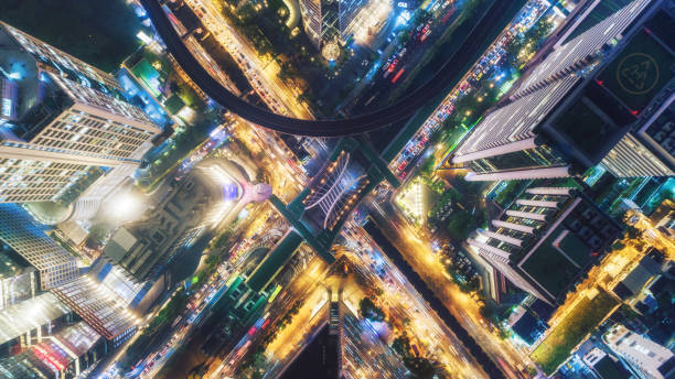 istock Highway road intersection in downtown at nigh for transportation, distribution or traffic background. 1043592950