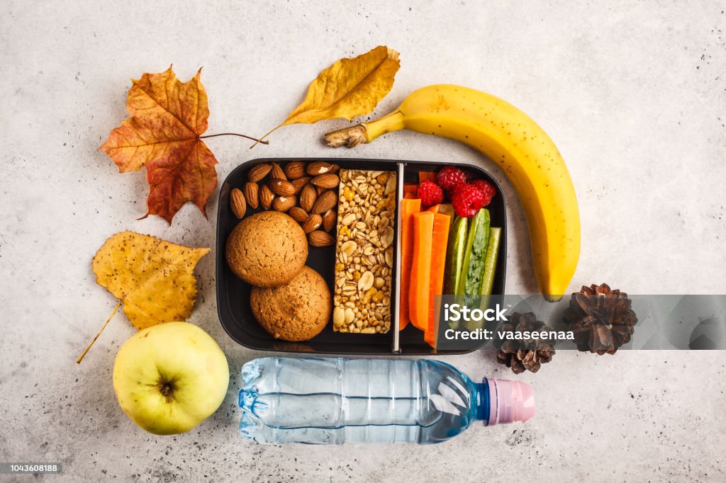Healthy Meal Prep Containers To School With Cereal Bar Fruits Vegetables  And Snacks Takeaway Food On White Background Top View Stock Photo -  Download Image Now - iStock