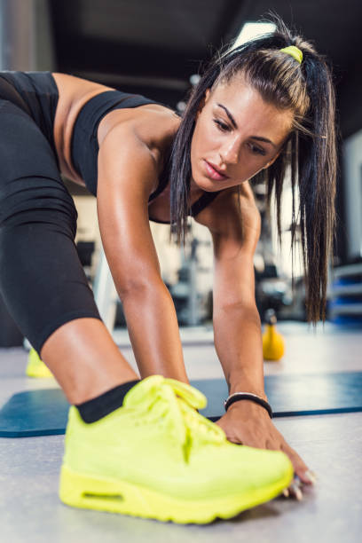 istock Sporty woman doing stretching exercise 1043608270