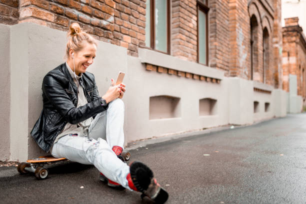 istock Young woman working outdoors with a mobile phone 1043619376